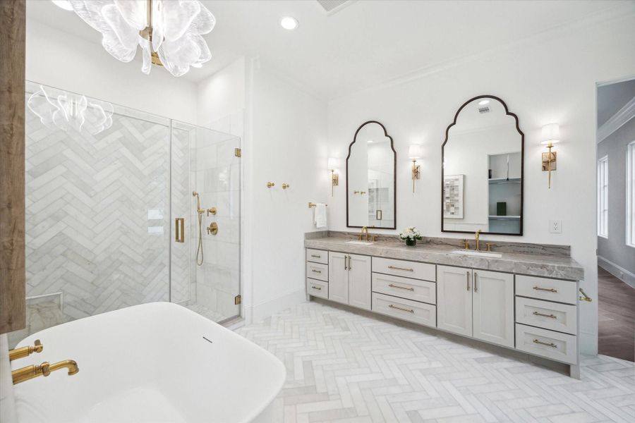 Custom Benedettini cabinetry, stone countertops, Kallista sinks with Kallista fixtures, and designer light fixtures complete the luxurious bathrooms. *Photo is of another home in the community and for informational purposes only. Custom Benedettini cabinetry, stone countertops, Kallista sinks with Kallista fixtures, and designer light fixtures complete the luxurious bathrooms. *Photo is of another home in the community and for informational purposes only.