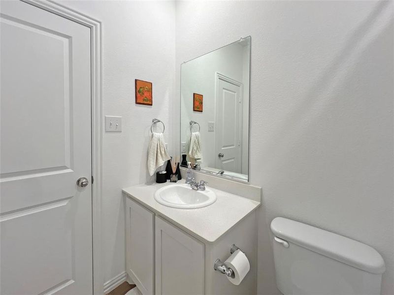 Bathroom featuring vanity and toilet
