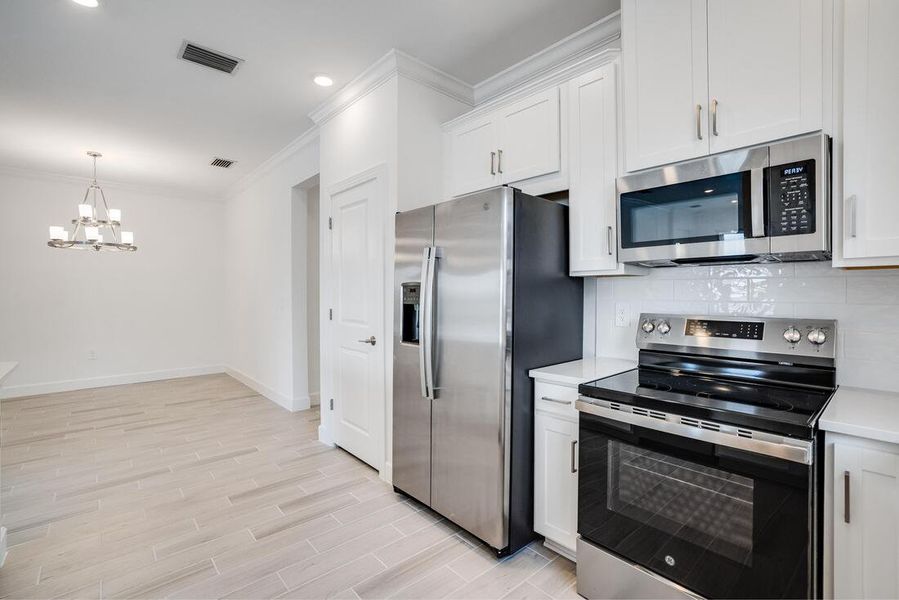 Representative furnished interior of a home built from the Tobago by Taylor Morrison in The Cove at West Port, Port Charlotte (Image 3).