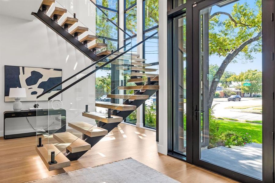 Foyer with wood finished floors and stairs Foyer with wood finished floors and stairs