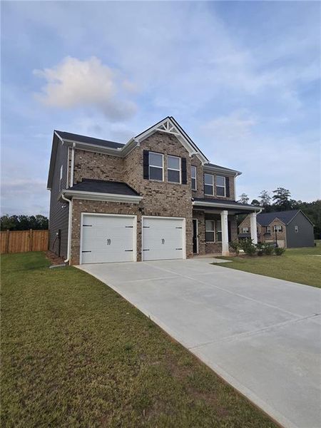 Front exterior of a new home in Fern Dale, Fairburn, GA, highlighting curb appeal (Image 32).