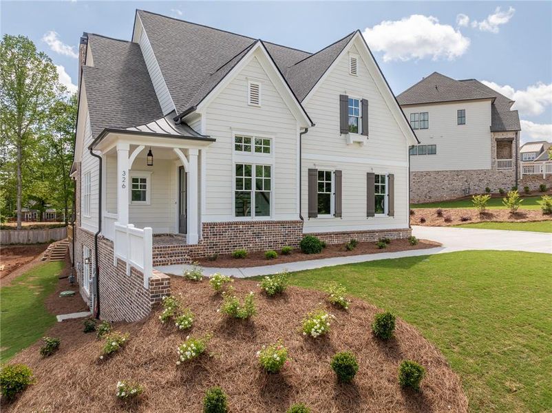 Front exterior of a new home in Malone's Pond, Ball Ground, GA, highlighting curb appeal (Image 1).