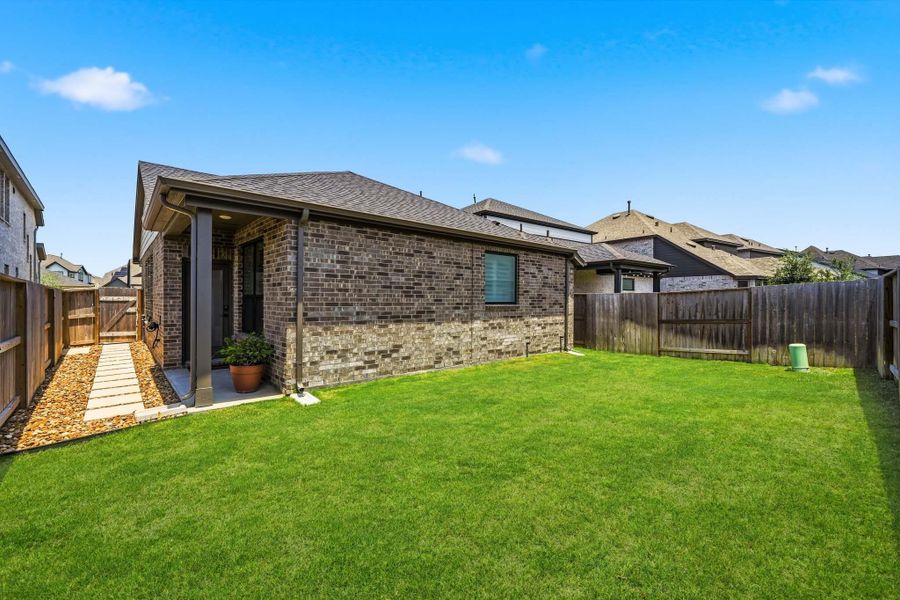 Exterior details and patio area of a home in Meridiana 40', 65', Iowa Colony (Image 21).