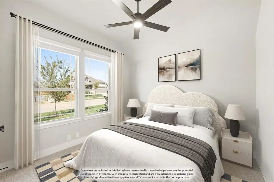 Bedroom with ceiling fan, large windows, and neutral carpet flooring