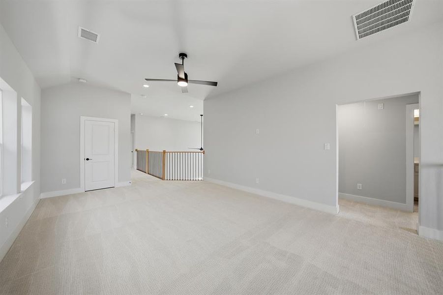 Spare room featuring light colored carpet, recessed lighting, and a ceiling fan