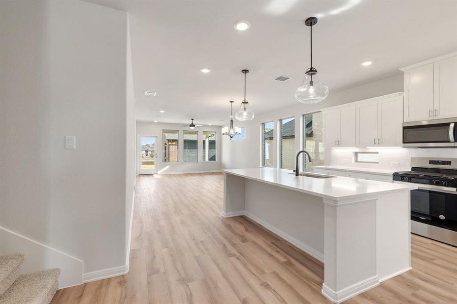 This open and flowing floor plan filled with natural light was designed for entertaining!