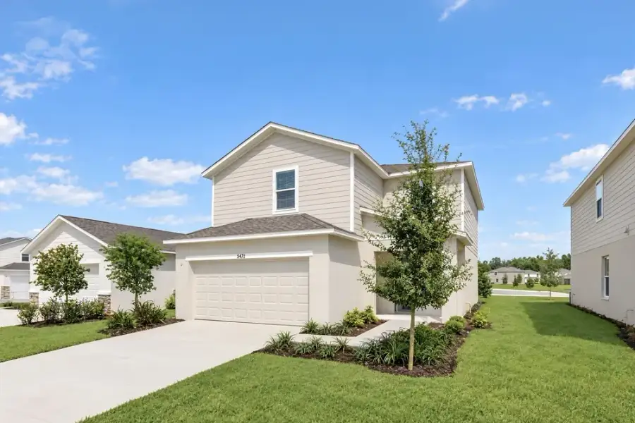 Representative exterior photo of a completed home built from the Dove by Taylor Morrison in Azure at Solaeris, Port St. Lucie, FL (Image 22).