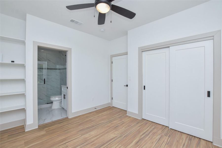 Bedroom #2 with it's own ensuite bathroom! Built in shelving. 2nd floor.