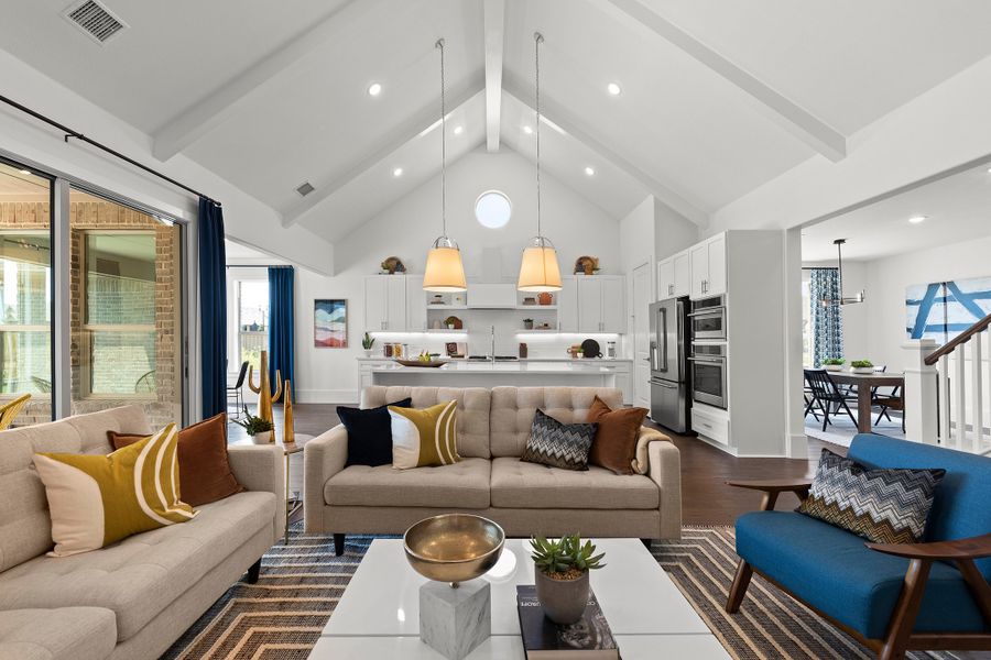 Great room with vaulted ceiling and white beams