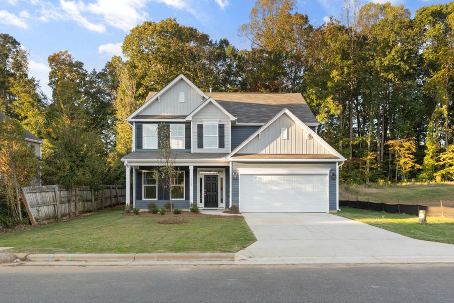 Front exterior of a new home in Chandler Ridge, McLeansville, NC, highlighting curb appeal (Image 2).