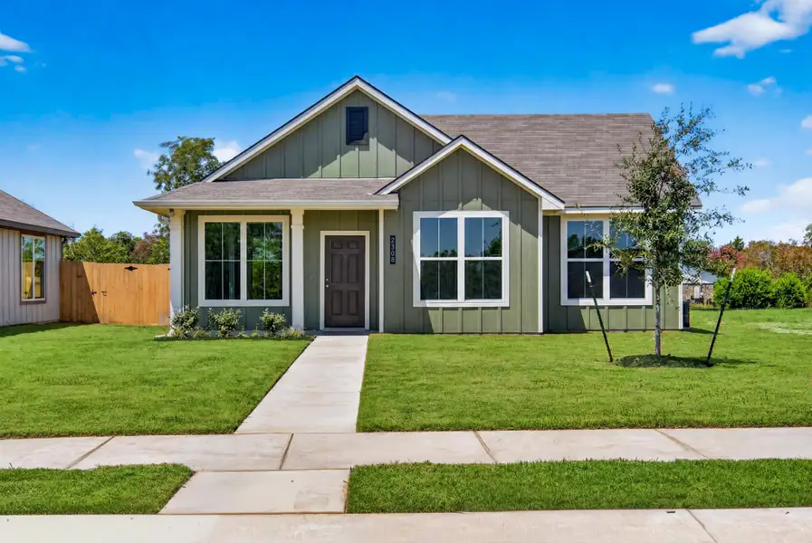 Front exterior of a new home in The Cottages at Pagosa Springs, Bryan, TX, highlighting curb appeal (Image 1). Front exterior of a new home in The Cottages at Pagosa Springs, Bryan, TX, highlighting curb appeal (Image 1).