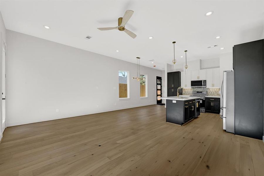 Wide Plank Engineered Wood Throughout Living Areas