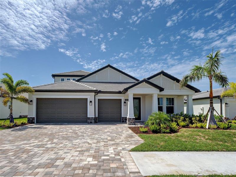 Front exterior of a new home in , Nokomis, FL, highlighting curb appeal (Image 2). Front exterior of a new home in , Nokomis, FL, highlighting curb appeal (Image 2).