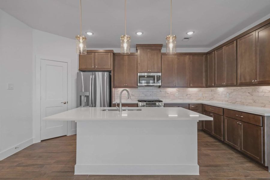 Representative furnished interior of a home built from the Carriagehouse by Chesmar Homes in Meridiana Townhomes, Iowa Colony (Image 51).