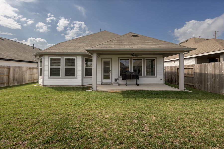 Exterior details and patio area of a home in Pinewood at Grand Texas, New Caney (Image 23).