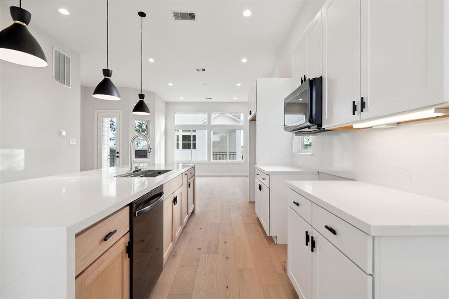 This chefs kitchen comes equipped with soft close cabinets and drawers and under-mount lighting with back counter space for any chef to prep.