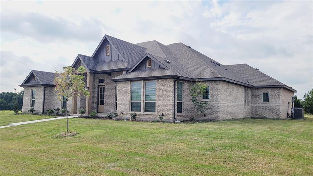 Front exterior of a new home in , DeSoto, TX, highlighting curb appeal (Image 1).