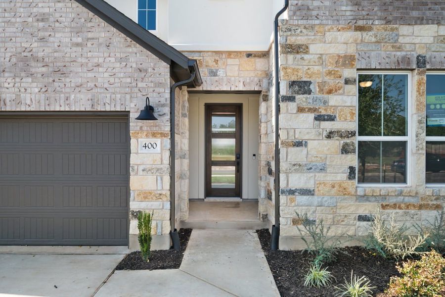 Exterior details and patio area of a home in Park Collection At Wolf Ranch, Georgetown (Image 3).