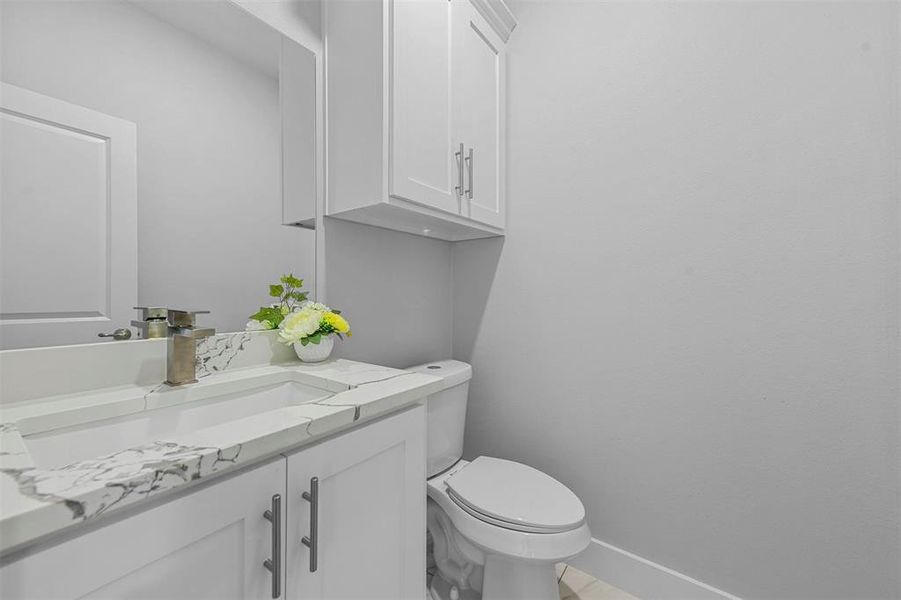 Bathroom featuring vanity and toilet