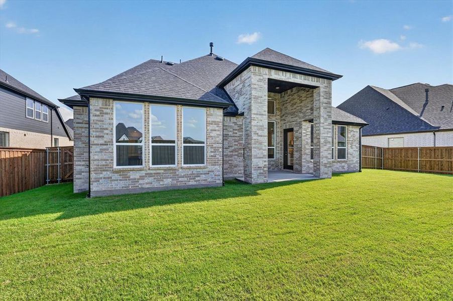 Exterior details and patio area of a home in Quail Hollow, Rockwall (Image 2).