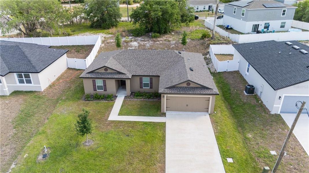 Front exterior of a new home in Poinciana, Poinciana, FL, highlighting curb appeal (Image 12).