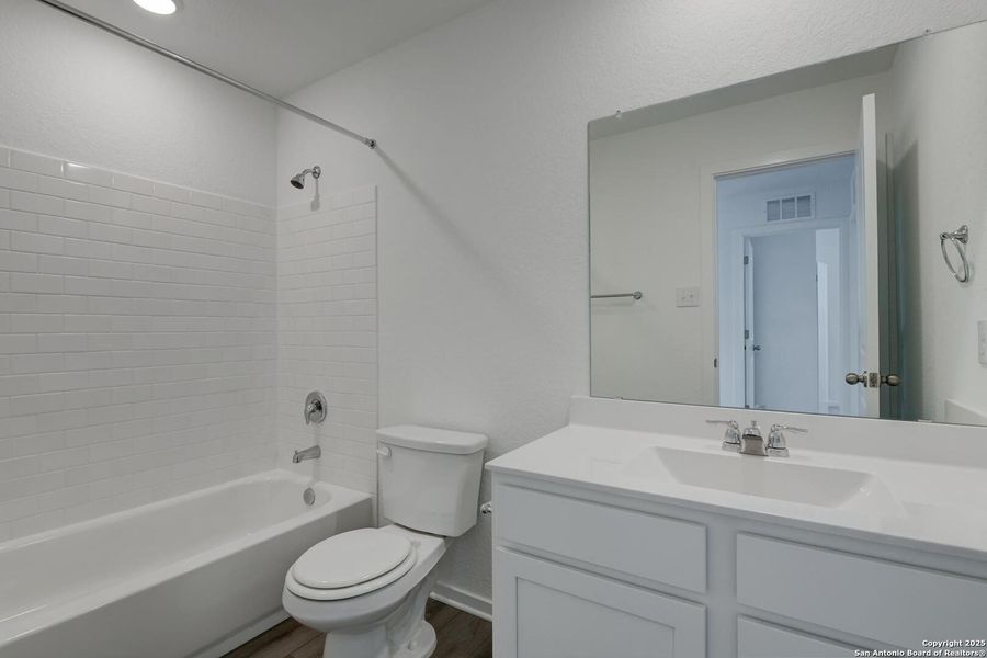 Furnished interior view inside a new home in Meadows at Hennersby Hollow 40's, San Antonio (Image 9).