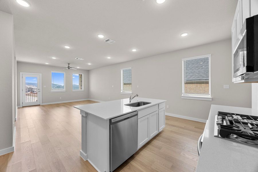 Kitchen in the Magnolia home plan by Trophy Signature Homes – REPRESENTATIVE PHOTO Kitchen in the Magnolia home plan by Trophy Signature Homes – REPRESENTATIVE PHOTO