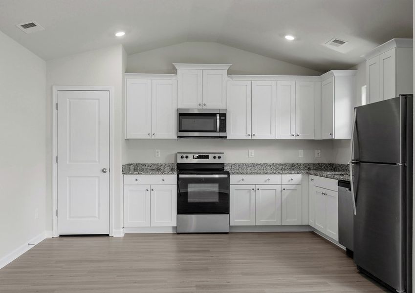 The kitchen comes with brand-new stainless steel appliances.