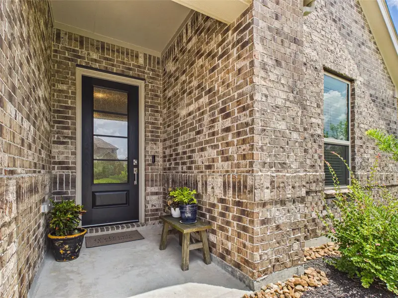 The inviting entry is highlighted with a beautiful 4 panel privacy glass front door.