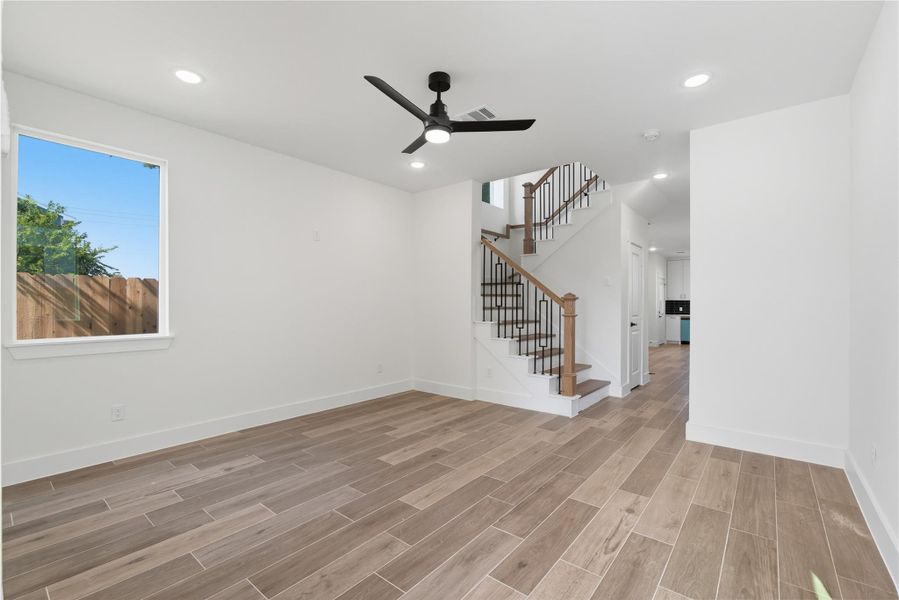 From the moment you step inside, you’ll feel right at home. This spacious living area is filled with natural light and stunning vinyl flooring, making it both beautiful and practical. With the open floor plan and easy flow to the kitchen, it’s the ideal space for family gatherings and everyday living.
