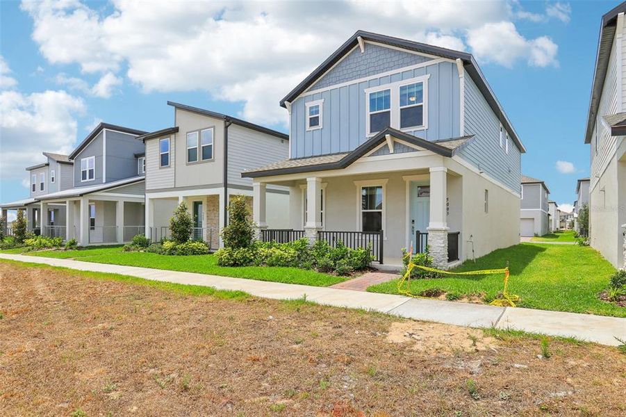 Front exterior of a new home in Silverleaf Reserve Bungalows, Winter Garden, FL, highlighting curb appeal (Image 18).