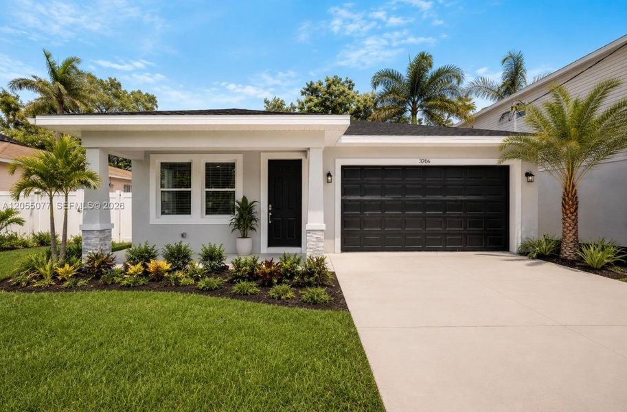 Front exterior of a new home in , Tampa, FL, highlighting curb appeal (Image 1). Front exterior of a new home in , Tampa, FL, highlighting curb appeal (Image 1).