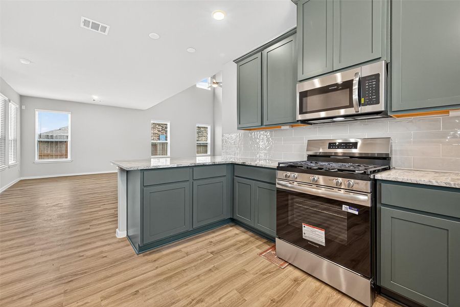 Furnished interior view inside a new home in Sunterra, Katy (Image 11).