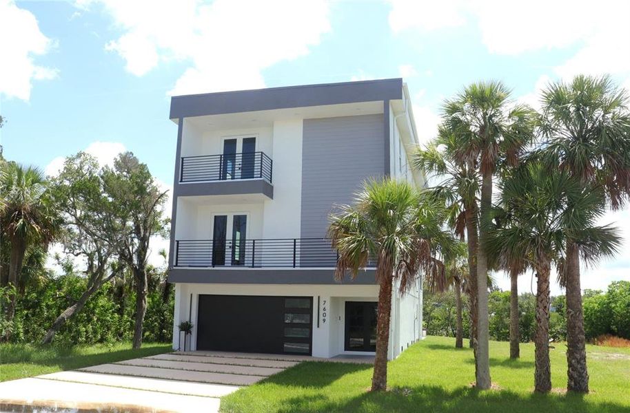 Front exterior of a new home in , Port Richey, FL, highlighting curb appeal (Image 25).