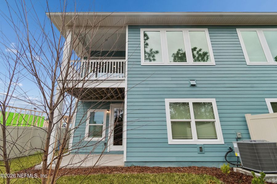 Exterior details and patio area of a home in Kettering at eTown - Paired Villas, Jacksonville (Image 3).