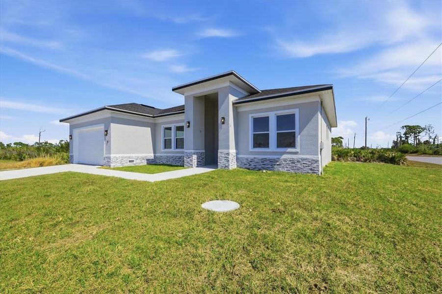 Front exterior of a new home in , Placida, FL, highlighting curb appeal (Image 24).