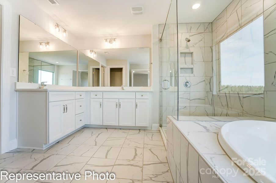 Primary bath includes a garden tub, separate shower and large walk-in closet