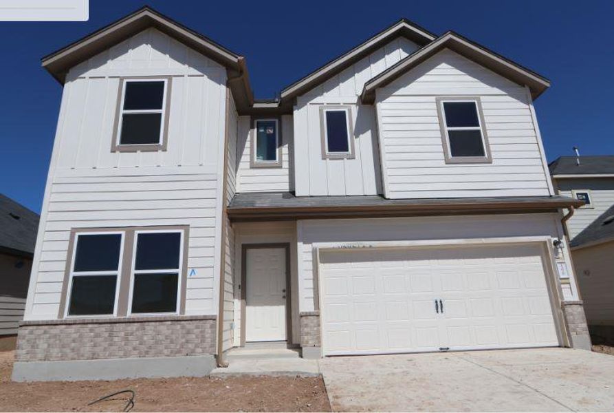 Front exterior of a new home in Cascades at Onion Creek, Austin, TX, highlighting curb appeal (Image 2). Front exterior of a new home in Cascades at Onion Creek, Austin, TX, highlighting curb appeal (Image 2).