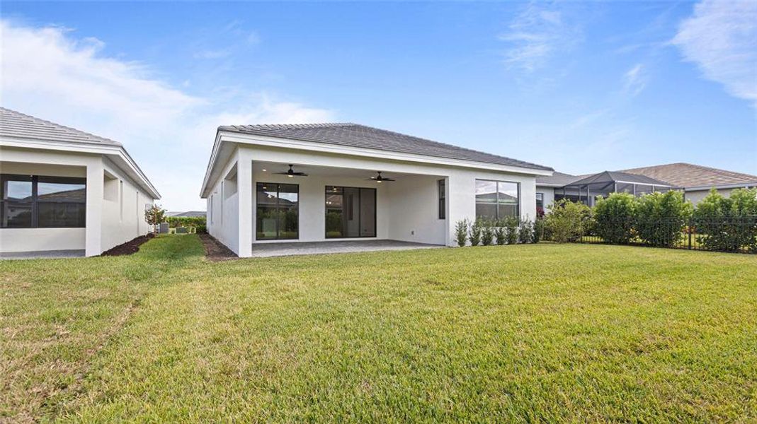 Exterior details and patio area of a home in Cresswind Lakewood Ranch, Lakewood Ranch (Image 4).