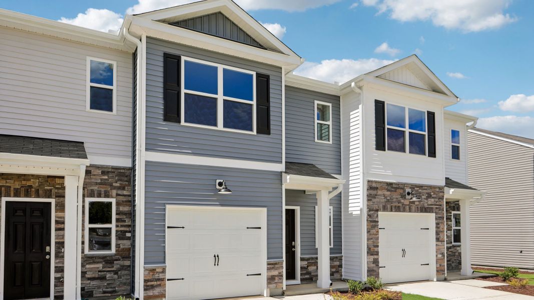 Front exterior of a new home in The Townes at Martin Farms, Aberdeen, NC, highlighting curb appeal (Image 2). Front exterior of a new home in The Townes at Martin Farms, Aberdeen, NC, highlighting curb appeal (Image 2).