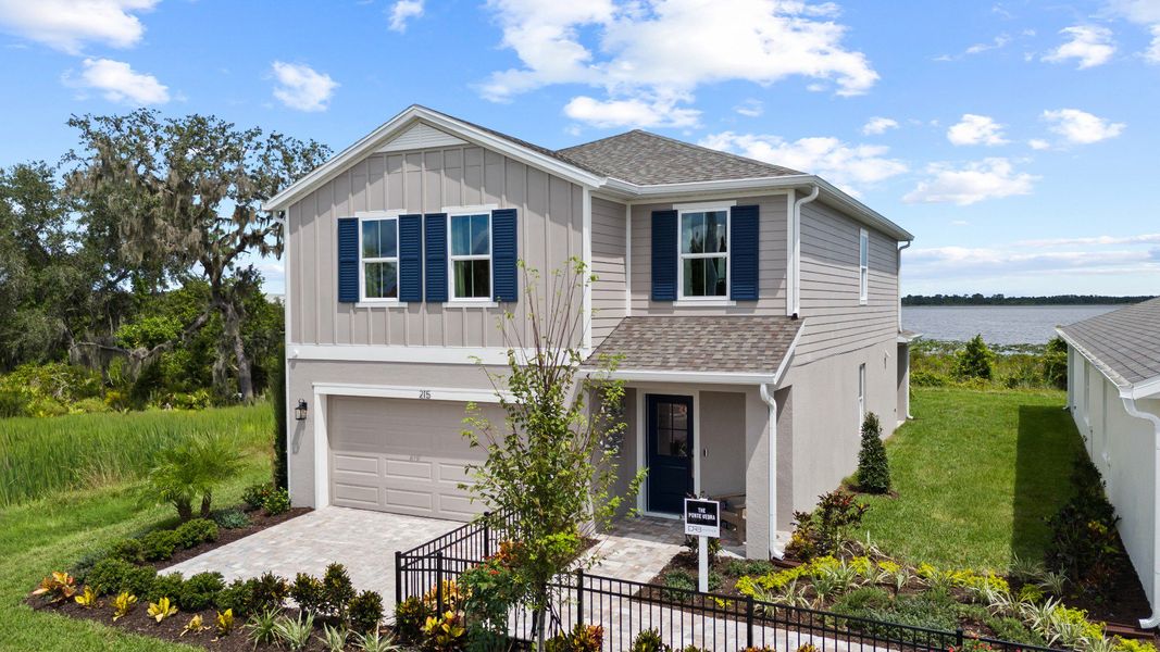 Representative exterior photo of a completed home built from the Ponte Verde by DRB Homes in Willowbrook North, Winter Haven, FL (Image 32). Representative exterior photo of a completed home built from the Ponte Verde by DRB Homes in Willowbrook North, Winter Haven, FL (Image 32).