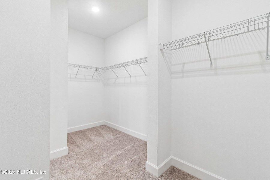 Spacious, unfurnished interior of a new home in Westerly Park at Wildlight - Courtyard Collection, Yulee (Image 21).