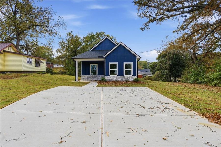Front exterior of a new home in , Carrollton, GA, highlighting curb appeal (Image 19).