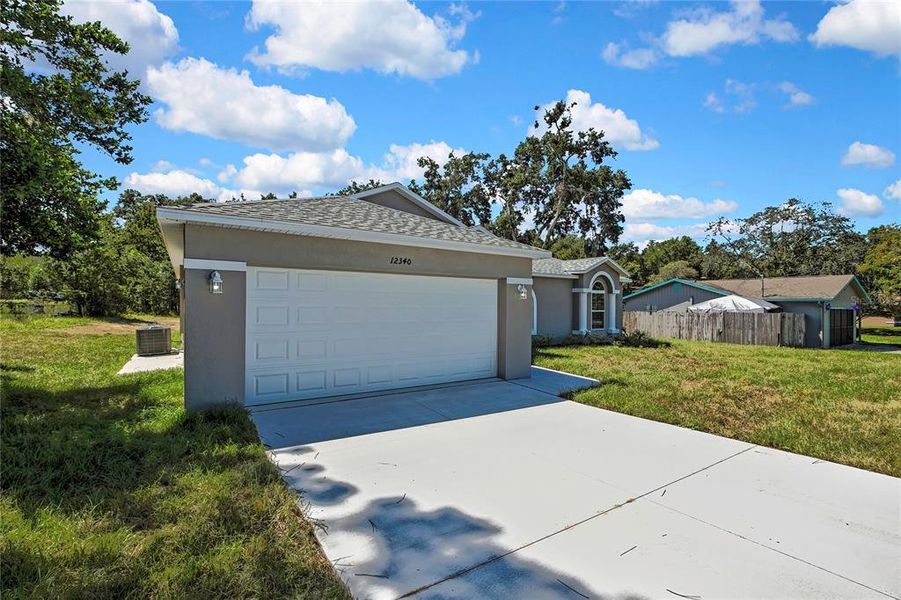 Front exterior of a new home in , Brooksville, FL, highlighting curb appeal (Image 24).