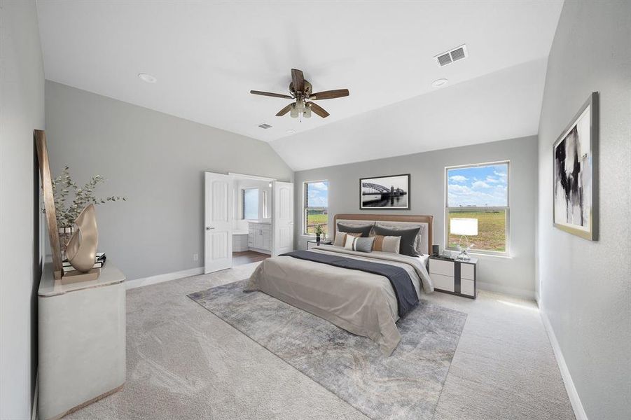 Carpeted bedroom with ceiling fan and lofted ceiling