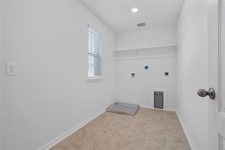 The Utility Room is spacious for your washer & dryer appliances and has a high shelf for all your laundering supplies.