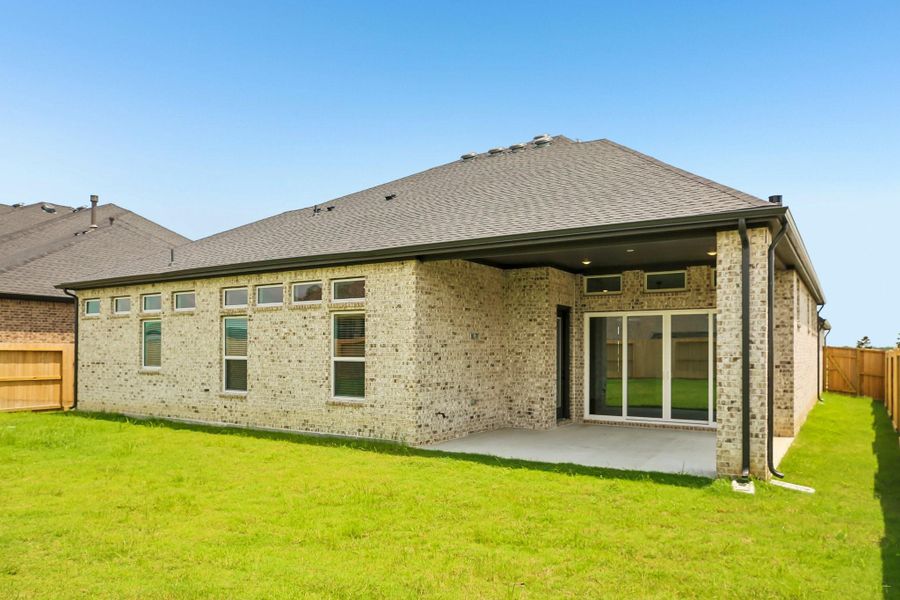 Exterior details and patio area of a home in Riceland 60',65',70', Old River-Winfree (Image 4).