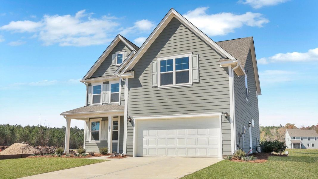 Front exterior of a new home in Berkeley Bay, Ridgeville, SC, highlighting curb appeal (Image 25).