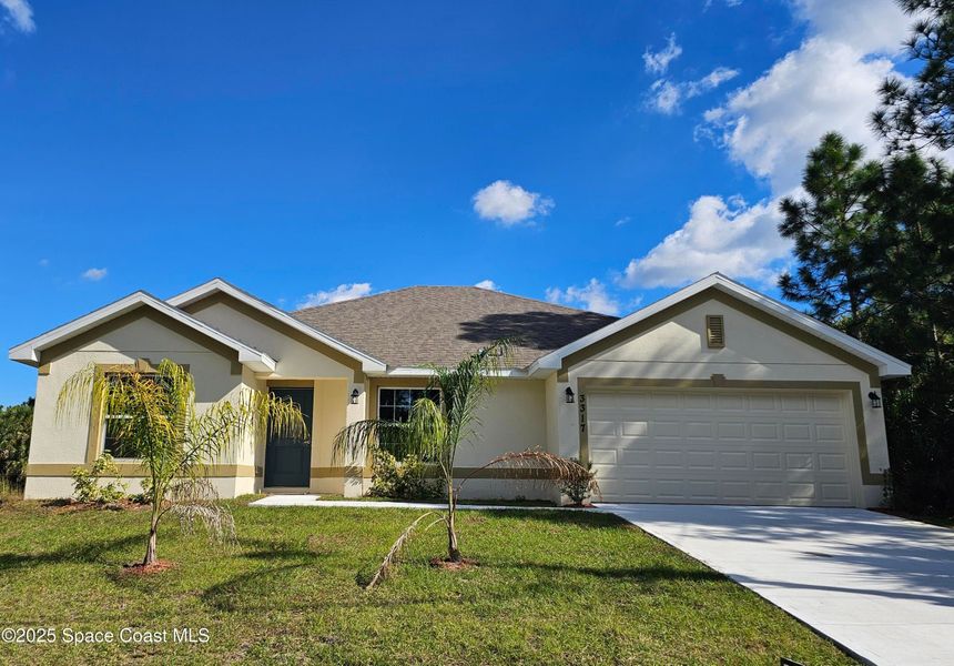Front exterior of a new home in Palm Bay, Palm Bay, FL, highlighting curb appeal (Image 1).