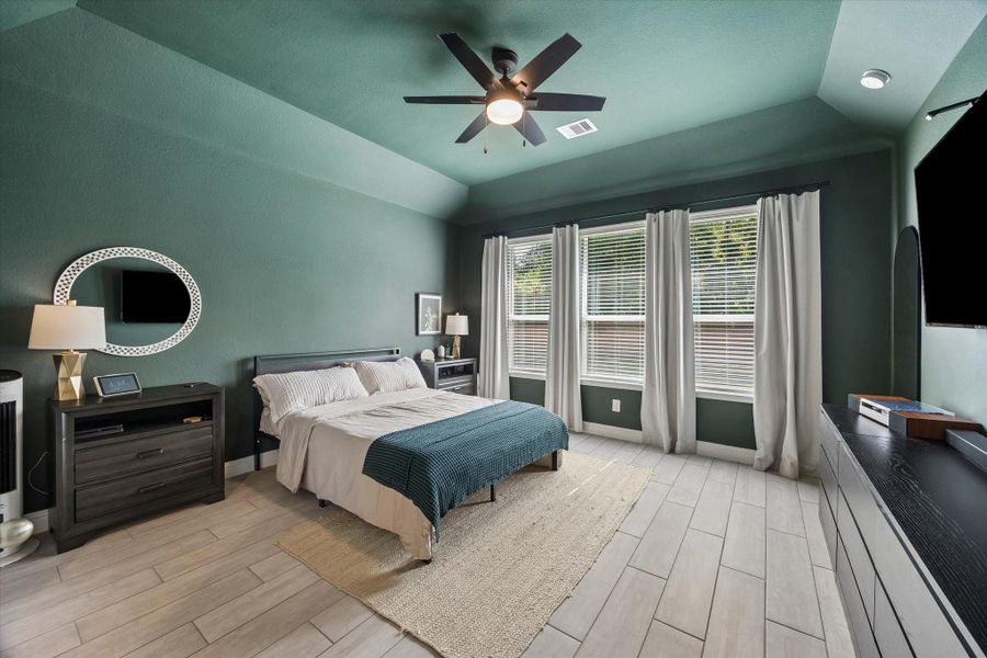 Retreat to the spacious primary suite, complete with a stylish accent wall. Retreat to the spacious primary suite, complete with a stylish accent wall.